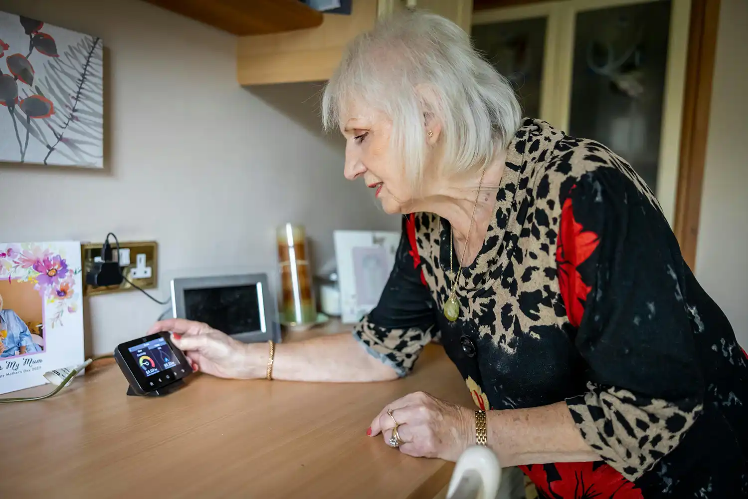 Woman checking her energy monitor